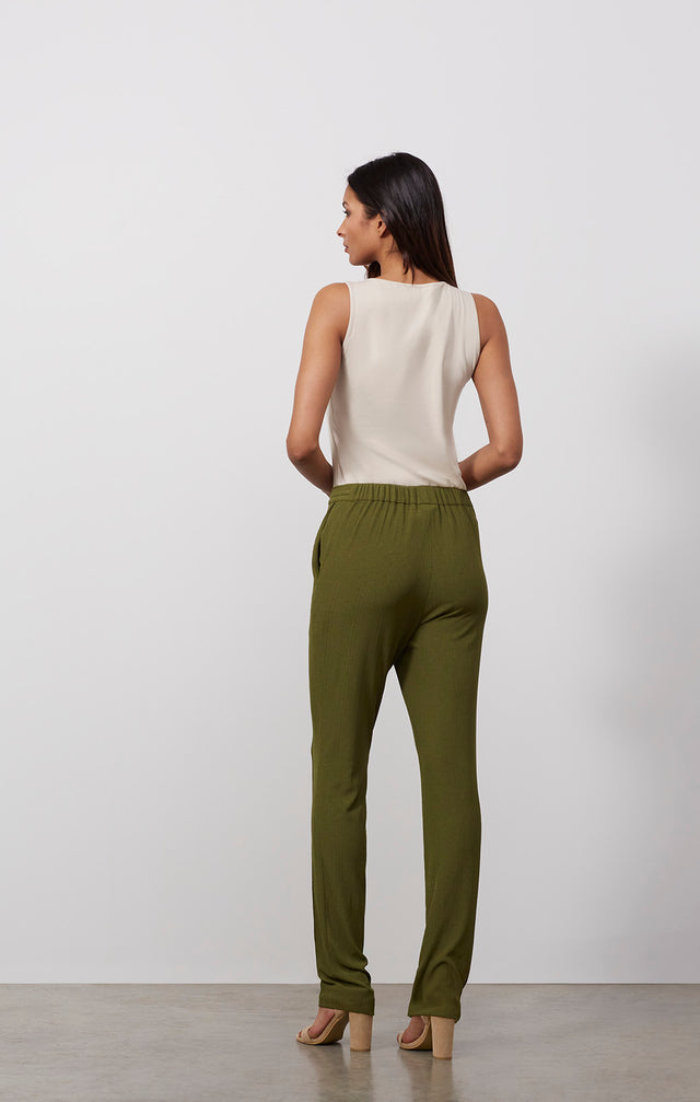 Ecomm photo of a model wearing the Areca pants, which is a knit pull-on drawstring lounge pants.