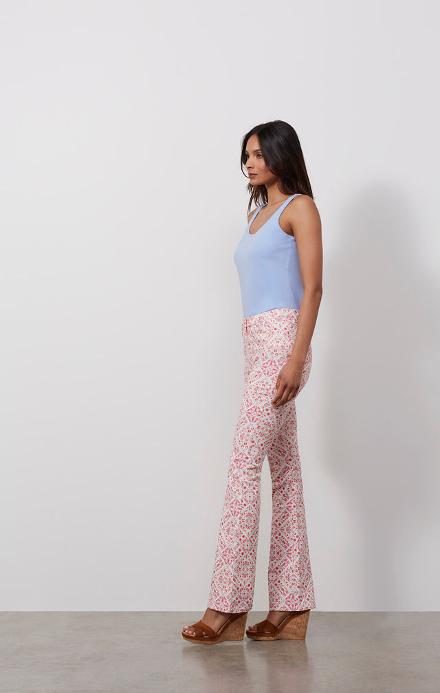 Ecomm photo of a model wearing the Spice pants, which is jeans in a placed Moroccan tile print.