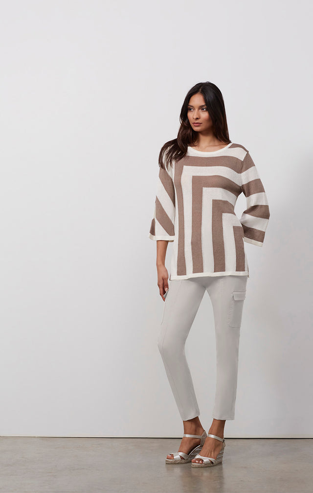 Ecomm photo of a model wearing the Andros sweater, which is a striped linen-blend pullover knit top.
