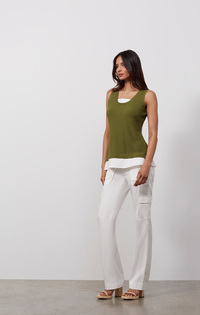 Ecomm photo of a model wearing the Areca shell,  which is a sleeveless knit tank top.