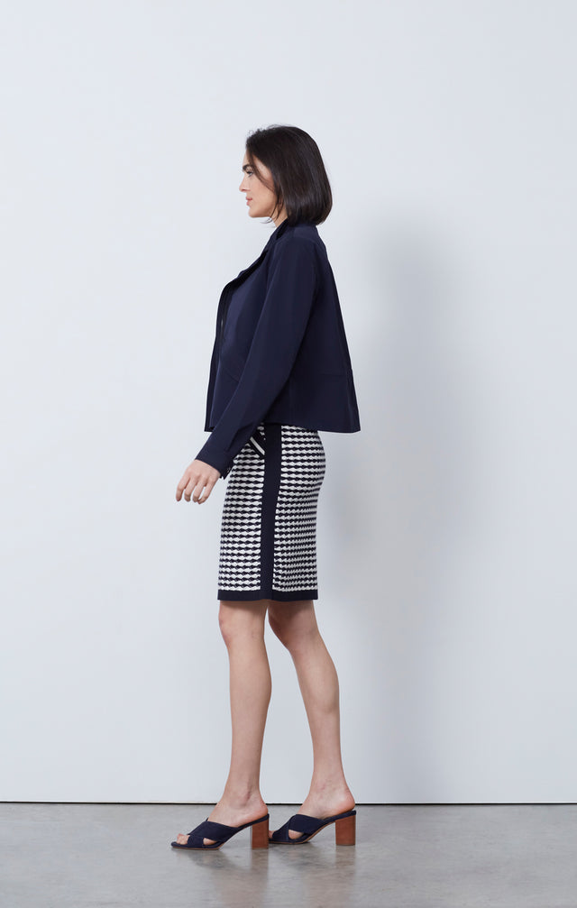 Ecom photo of model wearing the Bar Harbor jacket and Surging skirt.
