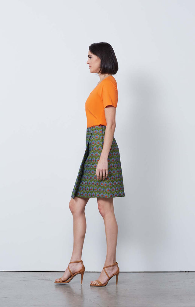 Image of model wearing the Chatsworth skirt with Tuscany Orange Top