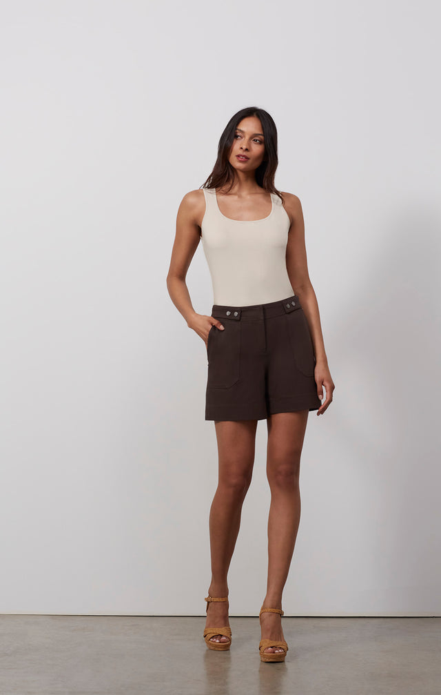 Ecomm photo of a model wearing the Berber shorts, which is a safari shorts in stretch cotton twill.