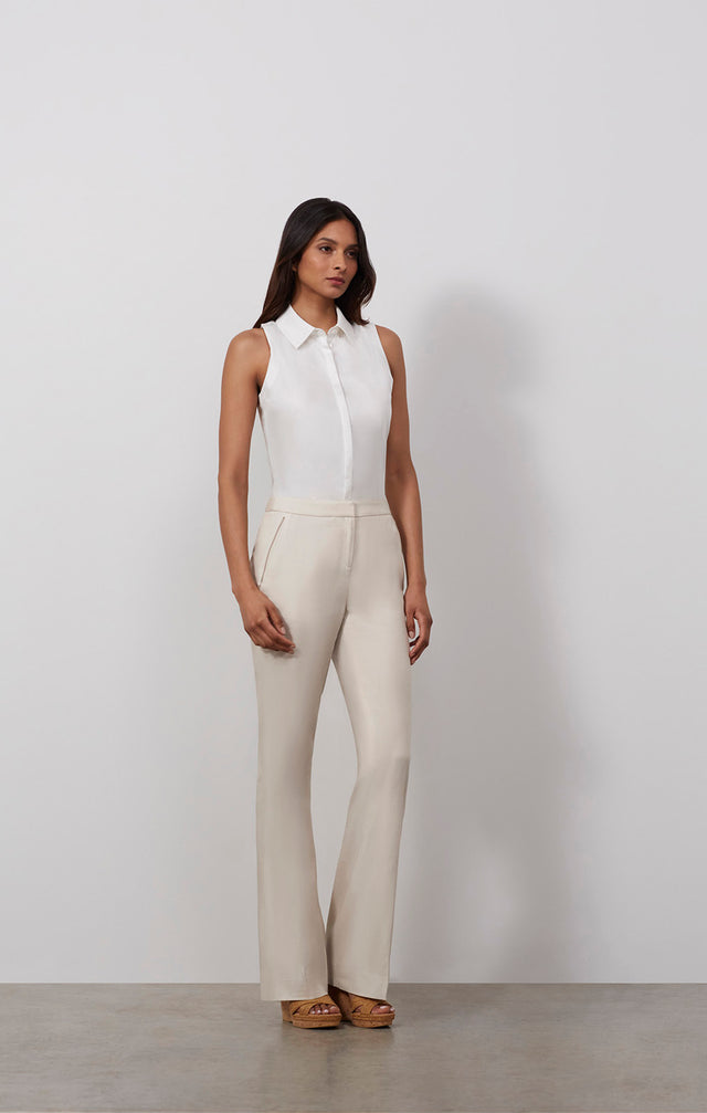 Ecomm photo of a model wearing the Sand Dollar pants, which is a tailored pants in stretch cotton suiting.