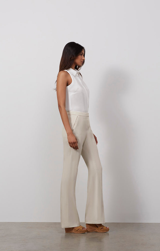 Ecomm photo of a model wearing the Sand Dollar pants, which is a tailored pants in stretch cotton suiting.