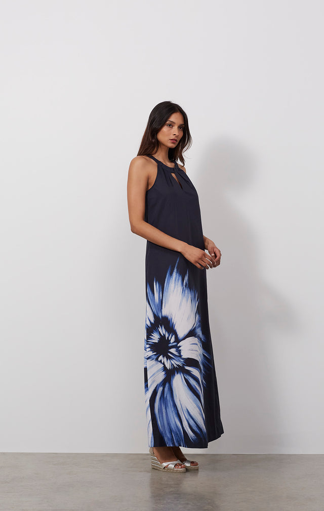 Ecomm photo of a model wearing the Celestial dress, which is a floral print cotton voile halter maxi dress.