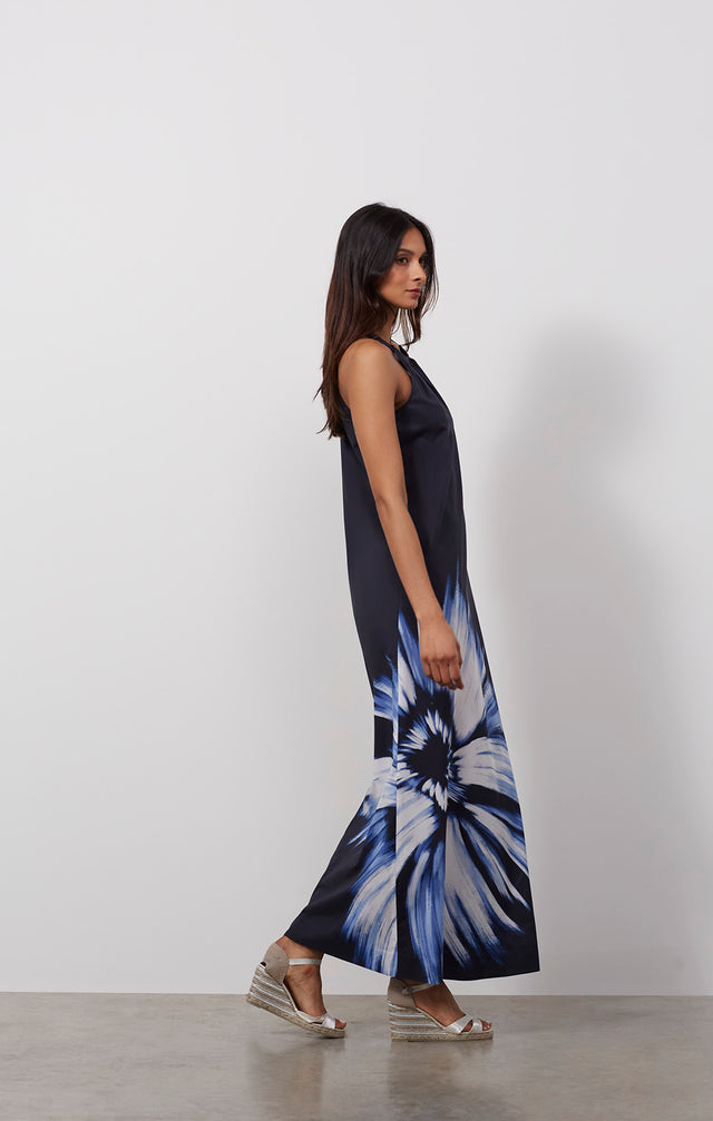 Ecomm photo of a model wearing the Celestial dress, which is a floral print cotton voile halter maxi dress.