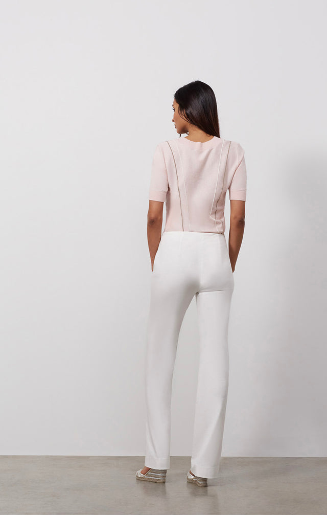Ecomm photo of a model wearing the Casablanca pants, which is a stretch linen-blend bootcut pants.