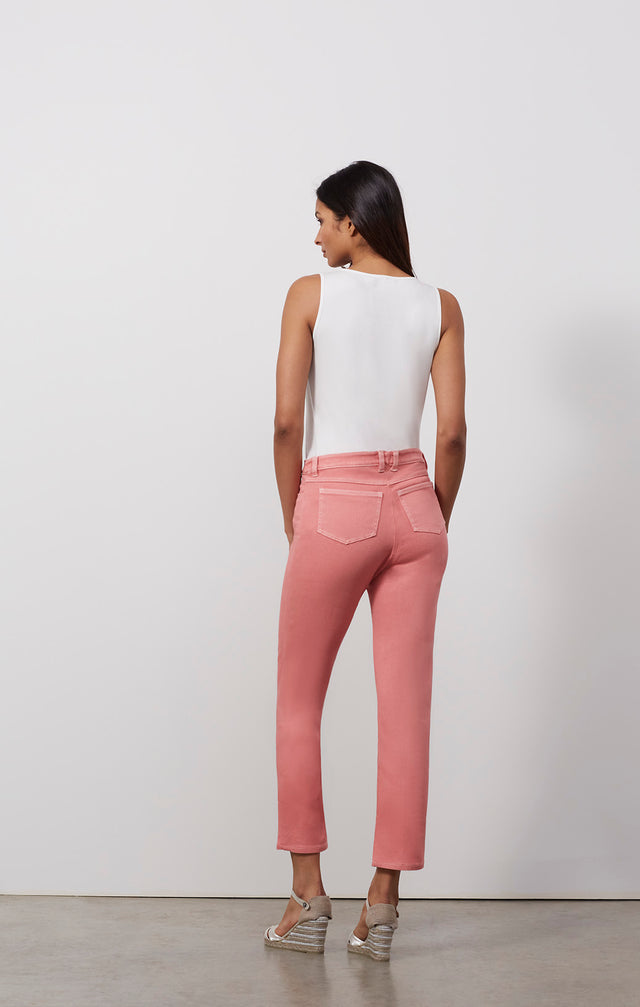 Ecomm photo of a model wearing the Trieste pants, which is a wash-softened pink denim jeans.