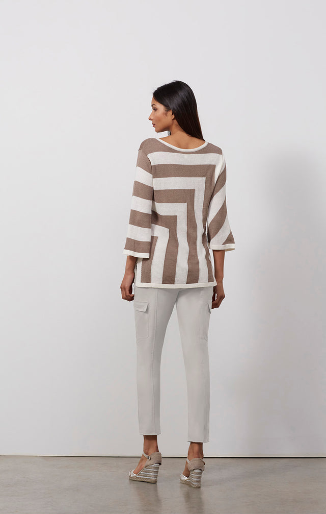 Ecomm photo of a model wearing the Andros sweater, which is a striped linen-blend pullover knit top.