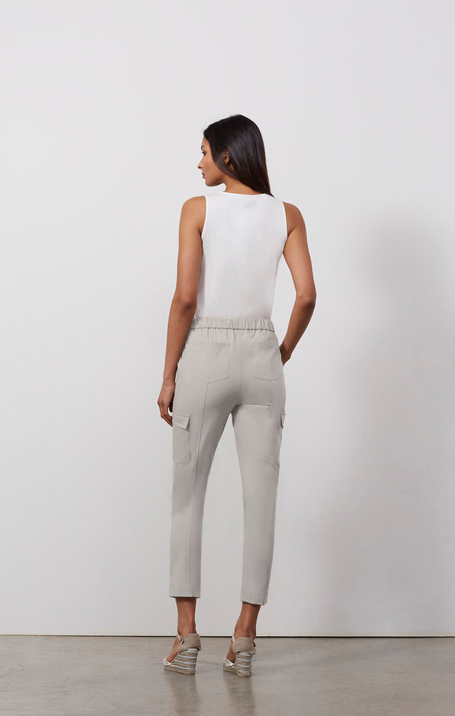 Ecomm photo of a model wearing the Capitola pants, which is a stretch utility travel pants.
