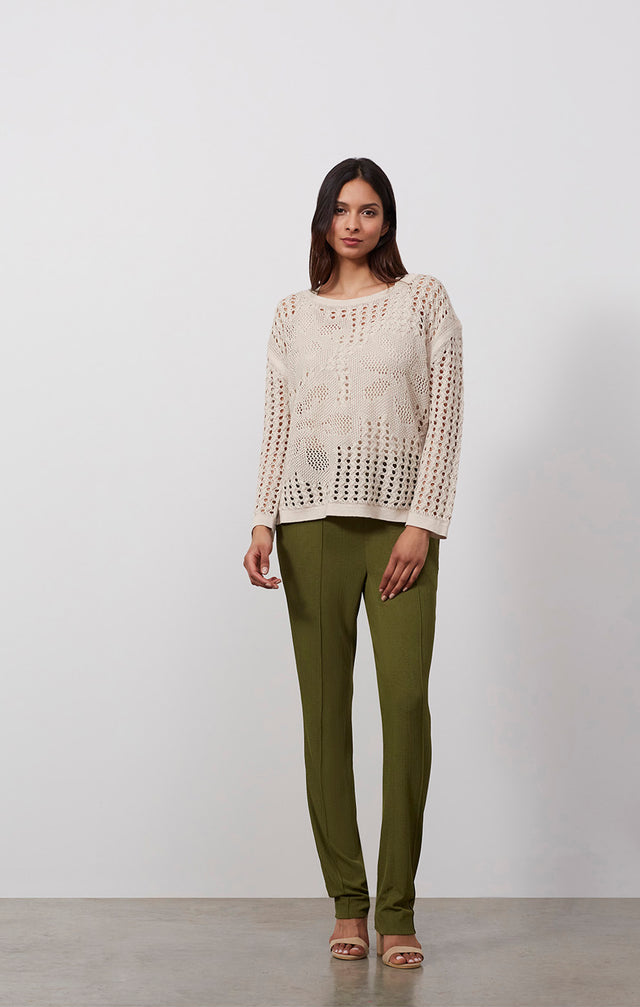 Ecomm photo of a model wearing the Sea Campion sweater, which is a pullover linen mesh knit top .