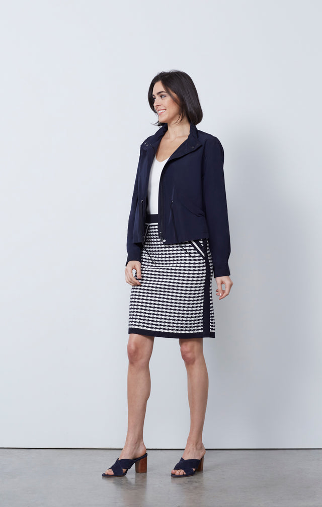 Ecom photo of model wearing the Bar Harbor jacket and Surging skirt.