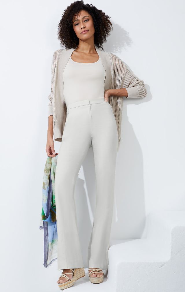  Lookbook photo of a model wearing the Sand Dollar pants, which is a tailored pants in stretch cotton suiting.