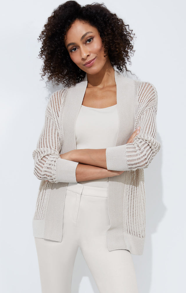 Lookbook photo of a model wearing the Ripples sweater, which is a linen-blend, open-front cardigan.