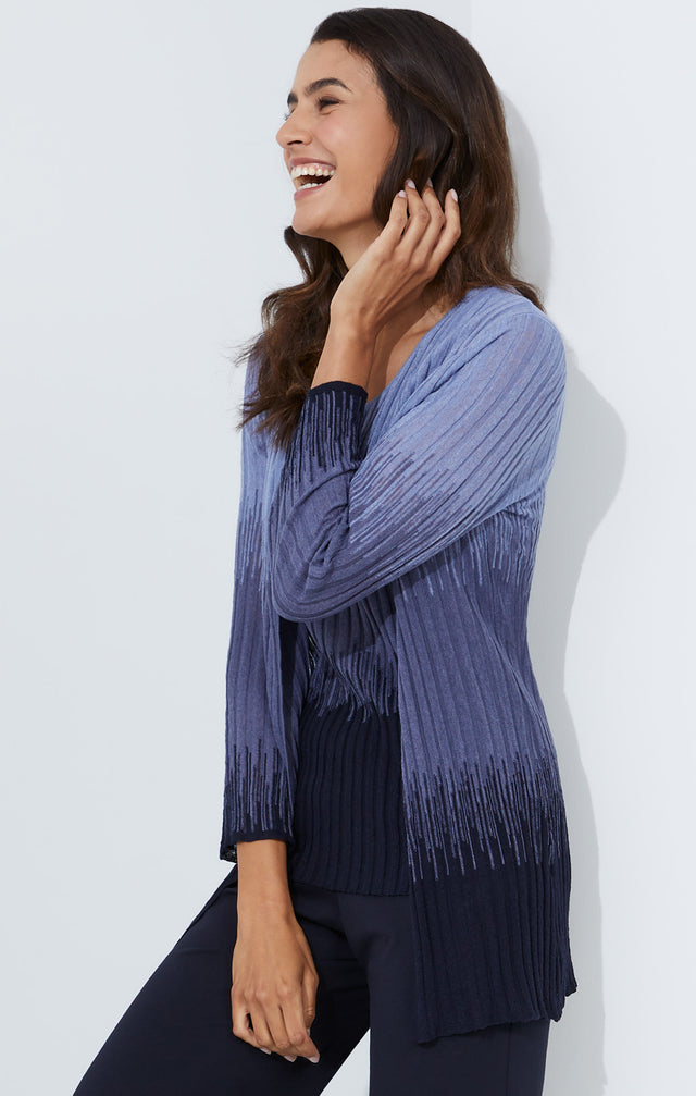 Lookbook photo of a model wearing the Gulf Stream sweater, which is a open-front knit cardigan in an intarsia ombré .